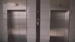 Explore the meanings of riding an elevator in dreams and
