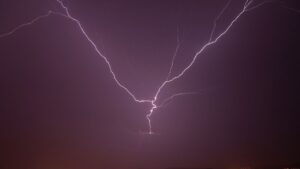 Discover NTT's innovative drone-based system directing lightning strikes safely, revolutionizing