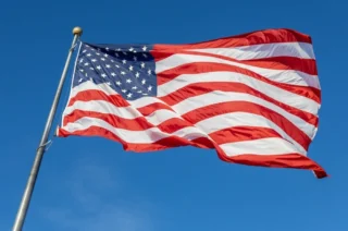 Defiant CEO Faces Legal Battle Over American Flag Display